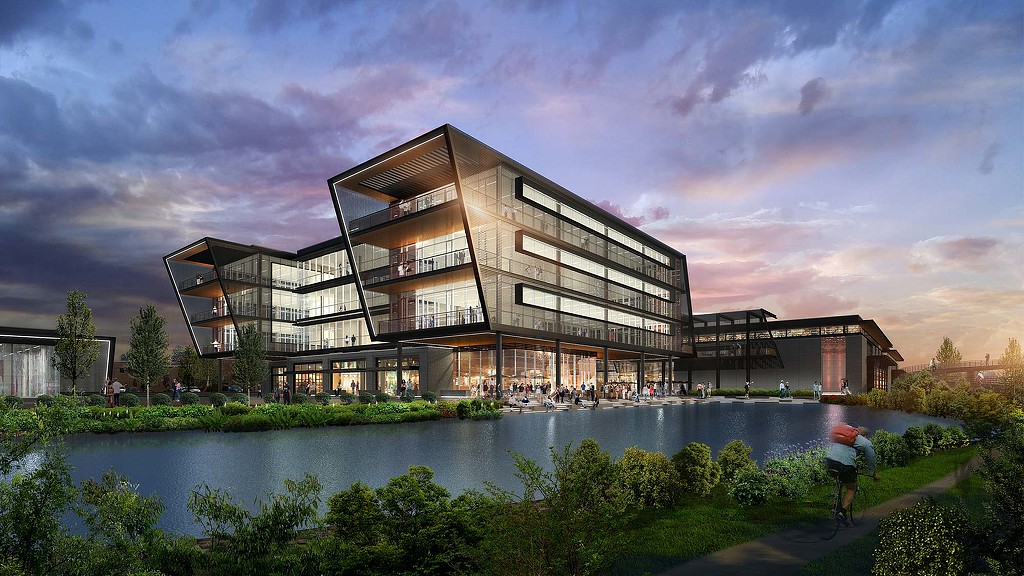 A building with a pond in front of it.